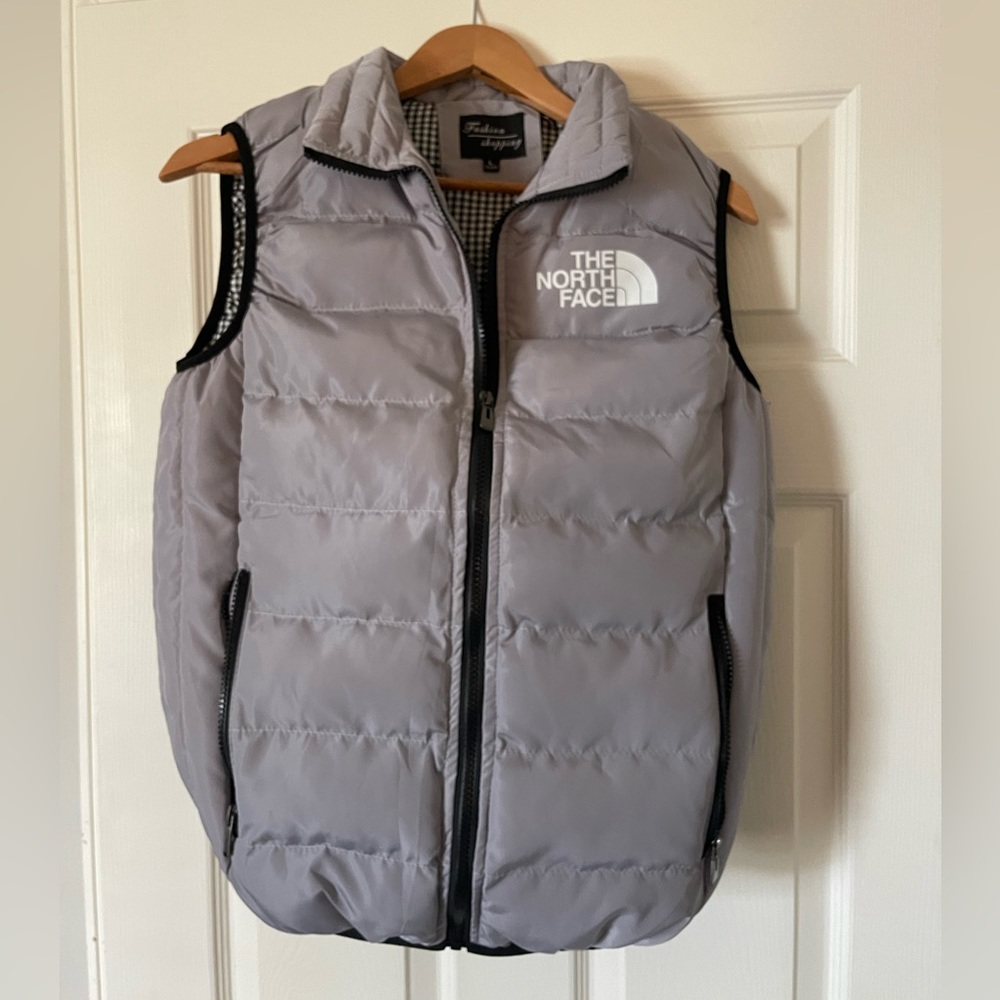 Youth Large, North Face zip vest. Like new. Only wore once. Excellent condition.